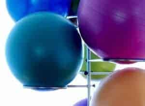 Top 10 Teacher Supplies: many different colored exercise or yoga balls on a rack for storage